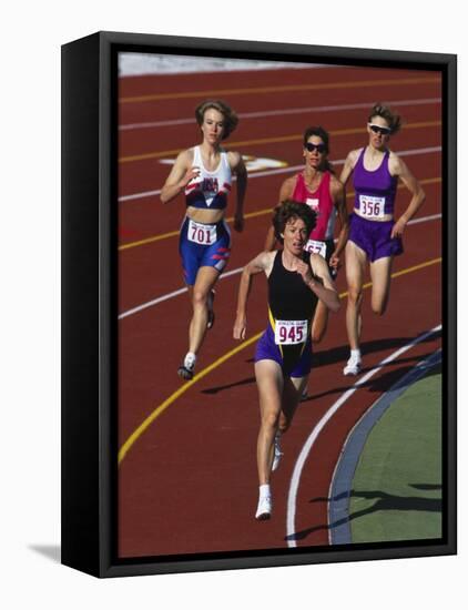 Female Runners Competing in a Track Race-null-Framed Stretched Canvas