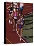 Female Runners Competing in a Track Race-null-Stretched Canvas