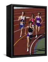 Female Runners Competing in a Track Race-null-Framed Stretched Canvas