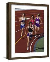 Female Runners Competing in a Track Race-null-Framed Photographic Print
