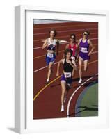 Female Runners Competing in a Track Race-null-Framed Photographic Print