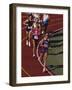 Female Runners Competing in a Track Race-null-Framed Photographic Print