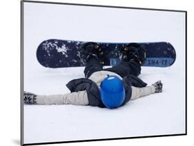 Female Snowboarder Collapsed after a Run, New York, USA-Paul Sutton-Mounted Photographic Print