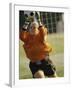 Female Soccer Goalie Catching the Ball-null-Framed Photographic Print