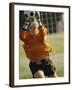 Female Soccer Goalie Catching the Ball-null-Framed Photographic Print