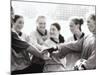 Female Soccer Team with Their Hands Together-null-Mounted Photographic Print