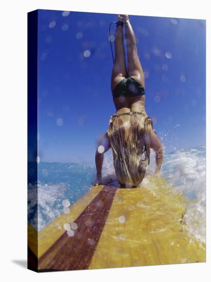 Female Surfer Doing a Headstand on a Surfboard-null-Stretched Canvas