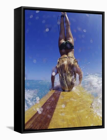 Female Surfer Doing a Headstand on a Surfboard-null-Framed Stretched Canvas