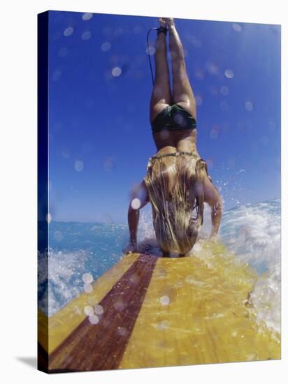 Female Surfer Doing a Headstand on a Surfboard-null-Stretched Canvas