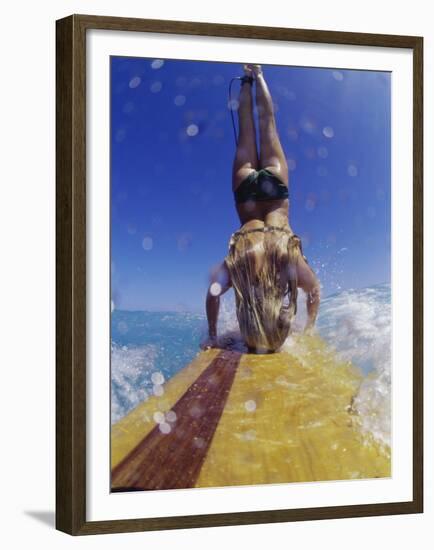 Female Surfer Doing a Headstand on a Surfboard-null-Framed Premium Photographic Print