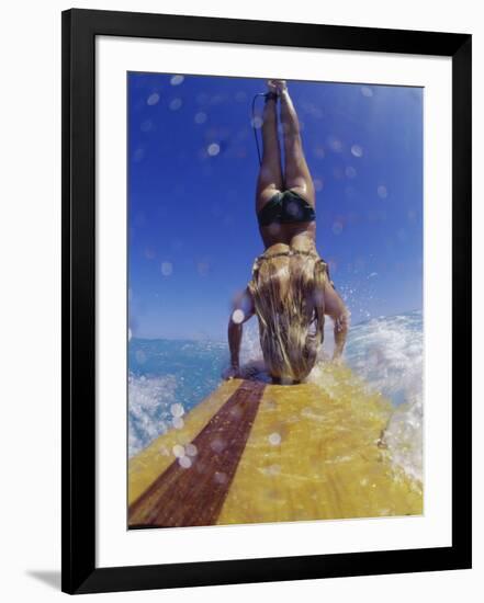 Female Surfer Doing a Headstand on a Surfboard-null-Framed Photographic Print