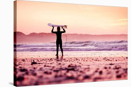 Female Surfer on the Beach at the Sunset-iko-Stretched Canvas