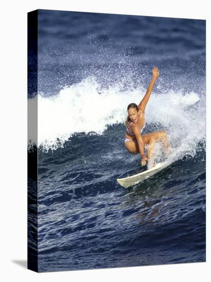 Female Surfer Riding a Wave-null-Stretched Canvas