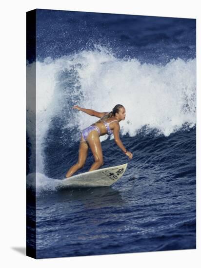 Female Surfer Riding a Wave-null-Stretched Canvas