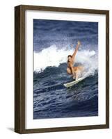 Female Surfer Riding a Wave-null-Framed Photographic Print