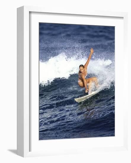 Female Surfer Riding a Wave-null-Framed Photographic Print