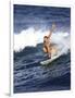 Female Surfer Riding a Wave-null-Framed Photographic Print