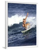 Female Surfer Riding a Wave-null-Framed Photographic Print