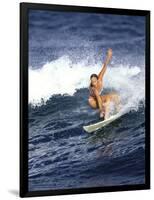 Female Surfer Riding a Wave-null-Framed Photographic Print