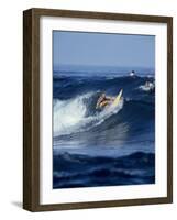 Female Surfer Riding a Wave-null-Framed Photographic Print