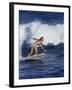 Female Surfer Riding a Wave-null-Framed Photographic Print