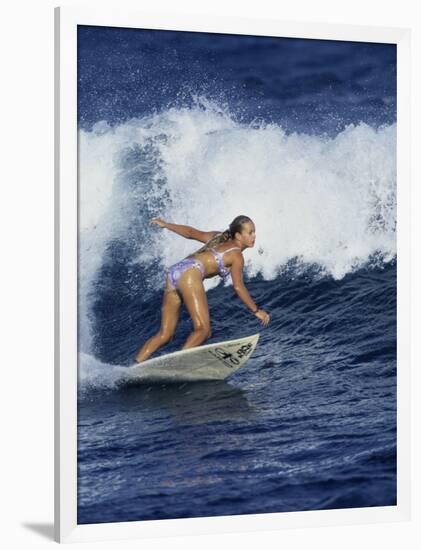 Female Surfer Riding a Wave-null-Framed Photographic Print