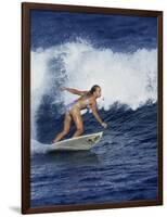 Female Surfer Riding a Wave-null-Framed Photographic Print