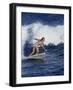 Female Surfer Riding a Wave-null-Framed Photographic Print