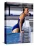 Female Swimmer Climbing Out of the Pool-null-Stretched Canvas