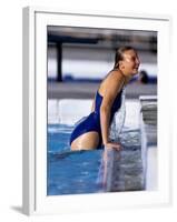 Female Swimmer Climbing Out of the Pool-null-Framed Photographic Print