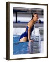 Female Swimmer Climbing Out of the Pool-null-Framed Photographic Print