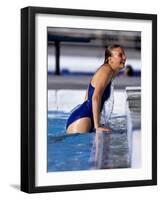 Female Swimmer Climbing Out of the Pool-null-Framed Photographic Print