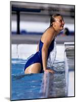 Female Swimmer Climbing Out of the Pool-null-Mounted Photographic Print