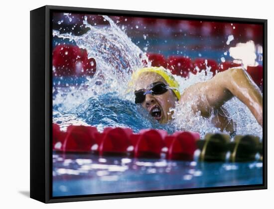 Female Swimmer Competing in a Race-null-Framed Stretched Canvas