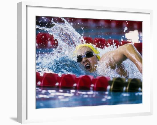 Female Swimmer Competing in a Race-null-Framed Photographic Print