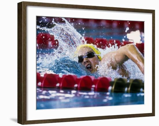 Female Swimmer Competing in a Race-null-Framed Photographic Print