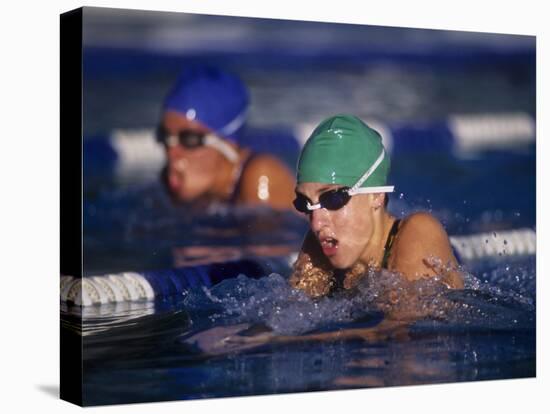 Female Swimmers Competing in a Breaststroke Race-null-Stretched Canvas