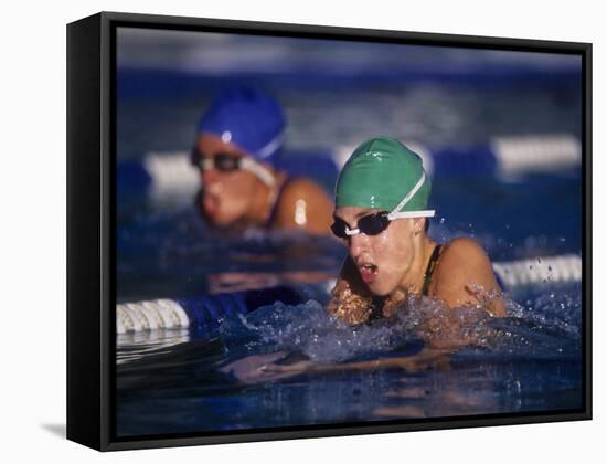 Female Swimmers Competing in a Breaststroke Race-null-Framed Stretched Canvas