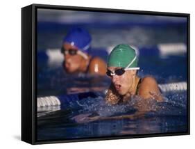 Female Swimmers Competing in a Breaststroke Race-null-Framed Stretched Canvas