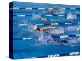 Female Swimmers Competing in a Freestyle Race-null-Stretched Canvas