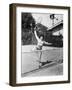 Female Tennis Player Reaching for Shot-null-Framed Photo