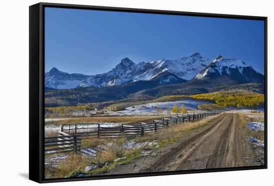 Fence Lined road and San Juan Mountain Range, Colorado-Darrell Gulin-Framed Stretched Canvas