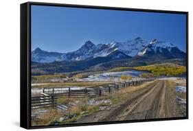 Fence Lined road and San Juan Mountain Range, Colorado-Darrell Gulin-Framed Stretched Canvas