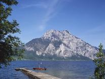 Wooden Boat Tied to Dock on Lake-Fernando Bengoechea-Photographic Print