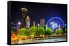 Ferris Wheel and Buildings Seen from Olympic Centennial Park at Night in Atlanta, Georgia.-Jon Bilous-Framed Stretched Canvas