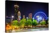 Ferris Wheel and Buildings Seen from Olympic Centennial Park at Night in Atlanta, Georgia.-Jon Bilous-Stretched Canvas