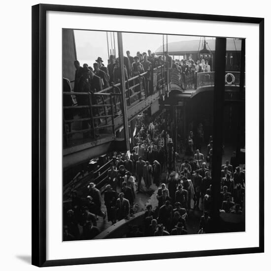 Ferry Boat Commuters from Staten Island Disembarking at Ferry Slip in Manhattan-Andreas Feininger-Framed Photographic Print