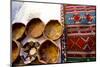 Fez Morocco leather baskets & oriental carpet on the wall in the old medina-Ellen Clark-Mounted Photographic Print