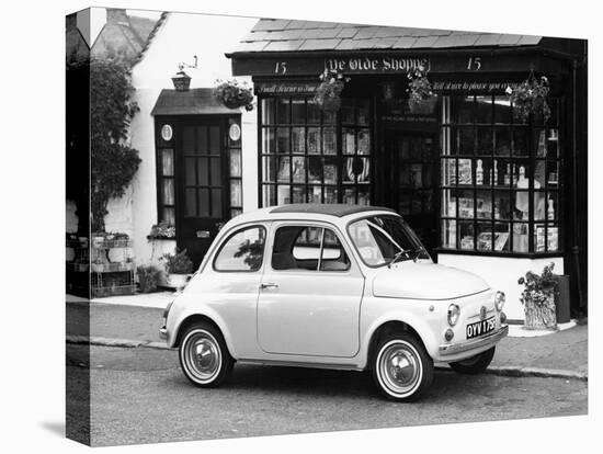 Fiat 500 Parked Outside a Quaint Shop, 1969-null-Stretched Canvas