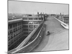 Fiat Car Driving Along the Desolate Street-Carl Mydans-Mounted Photographic Print